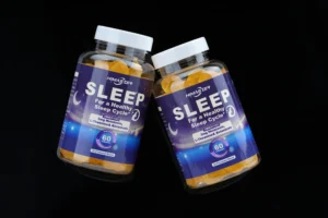 A professional looks calmly tired after sunset with sleep gummies nearby, symbolizing relaxation after a high-stress job.